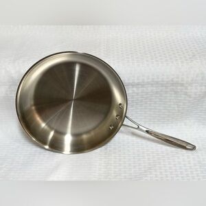 This is a Calphalon 1390 10" (25cm) stainless steel fry pan.